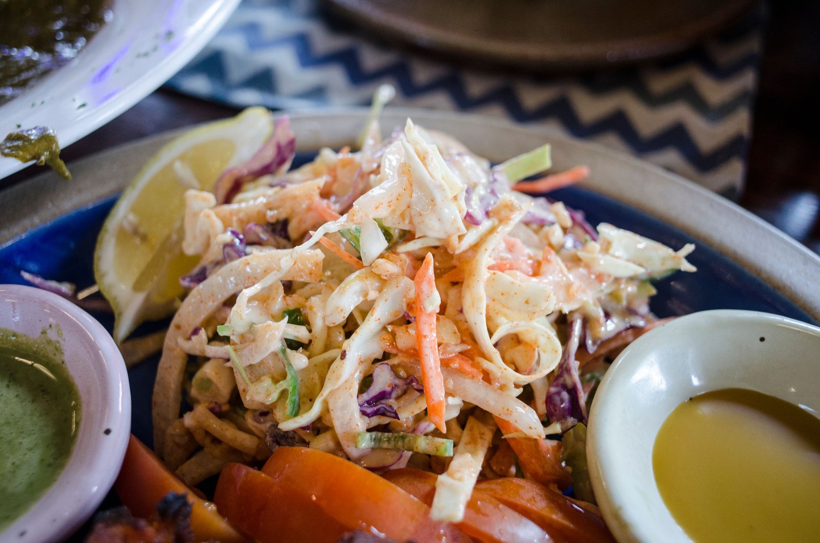A vibrant and healthy vegetable salad with lemon and dressing, perfect for a nutritious meal.